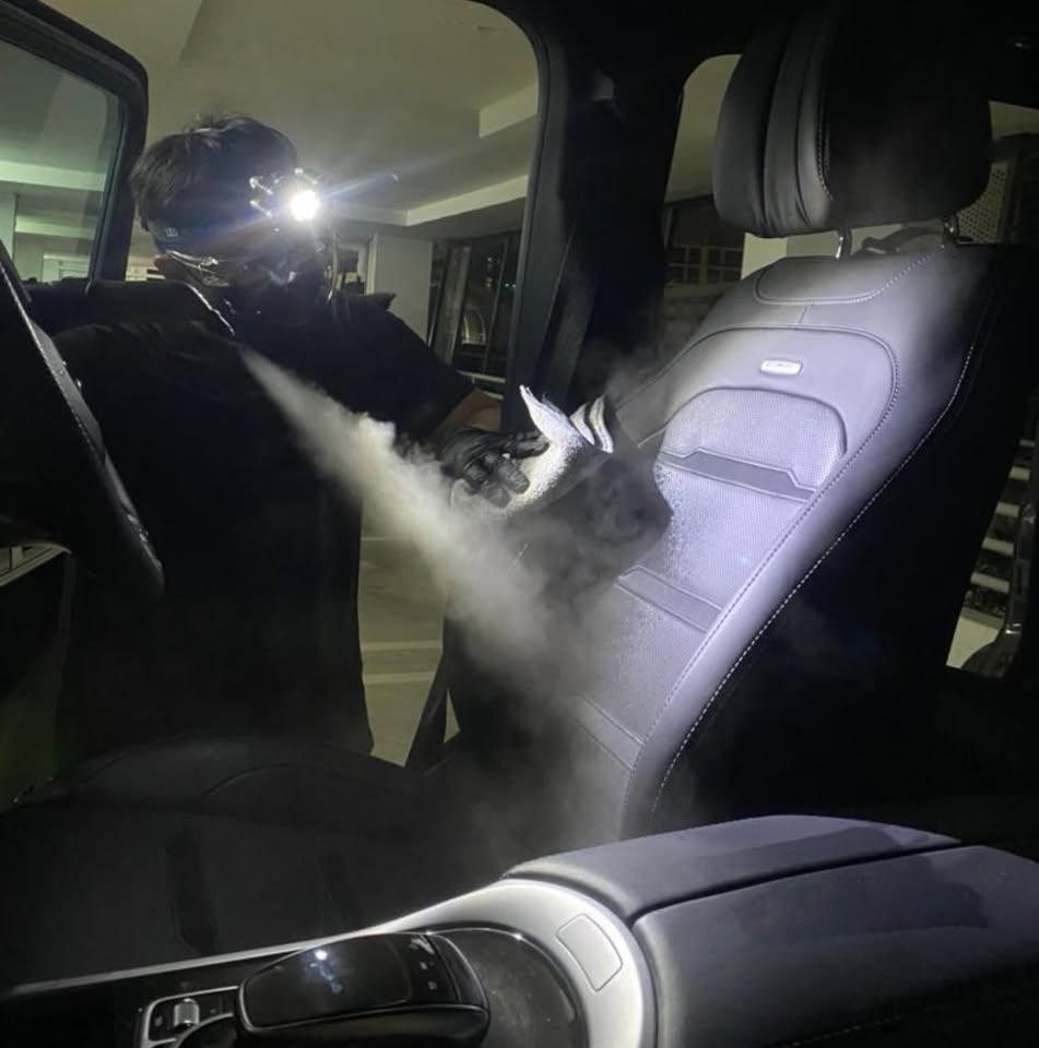 Cleanic specialist steam cleaning a car seat